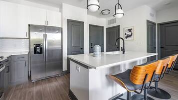 Apartment, 1 Bedroom | Private kitchen | Full-size fridge, oven, stovetop, dishwasher