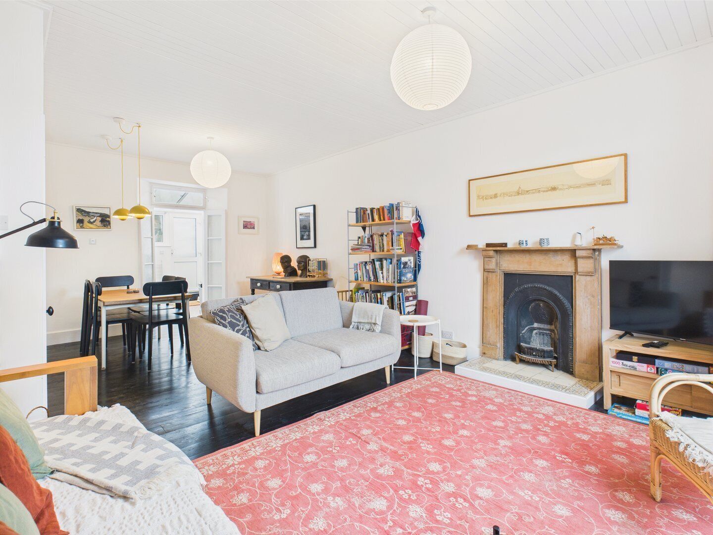 TV, fireplace, books