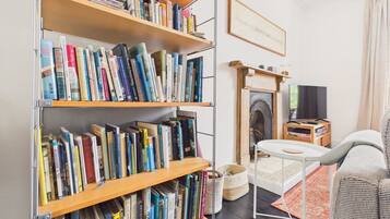 TV, fireplace, books