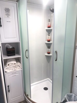 Shower, hair dryer, towels, soap