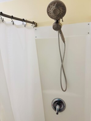Shower, hair dryer, towels, toilet paper
