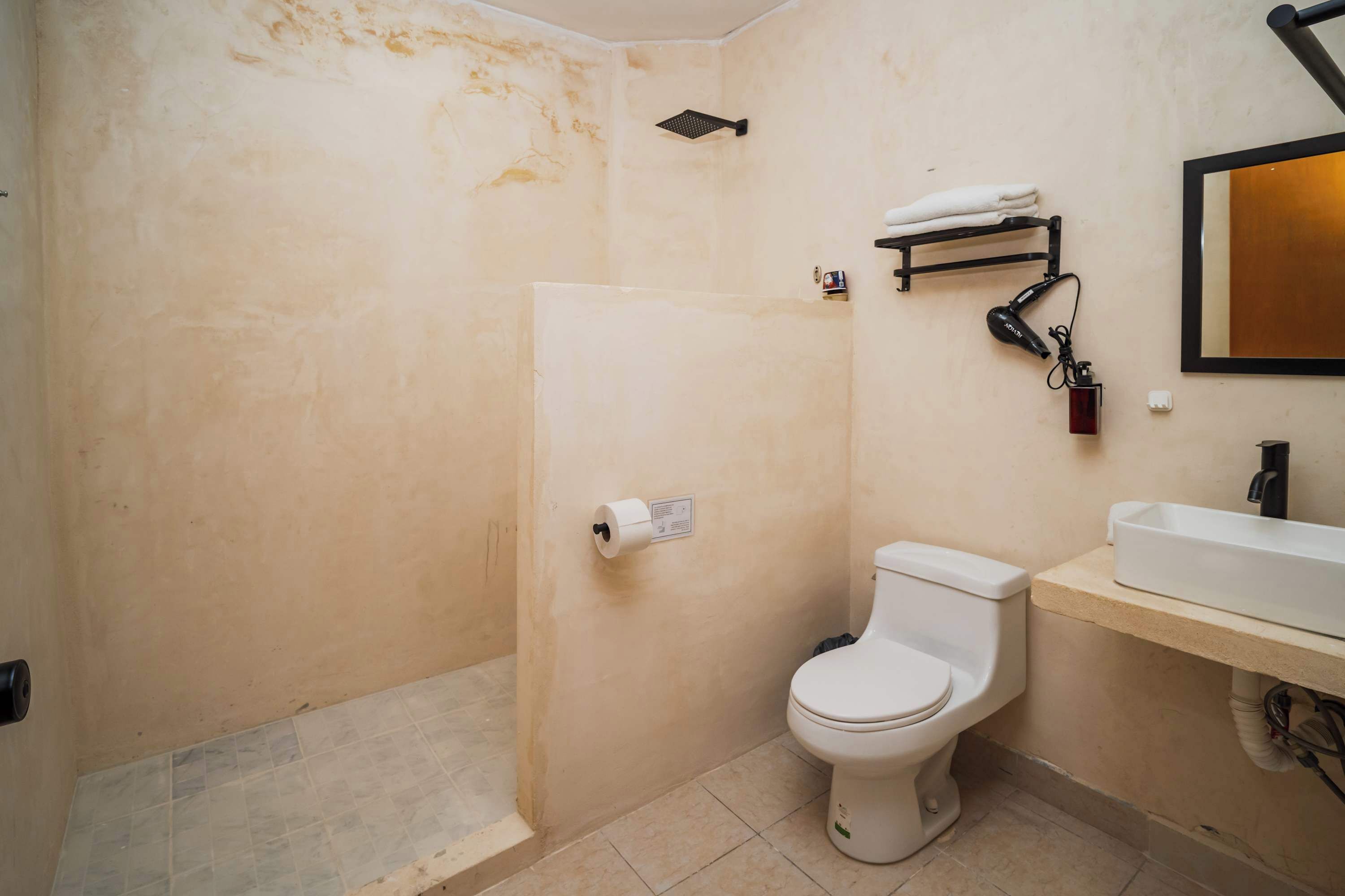 Shower, hair dryer, towels, shampoo