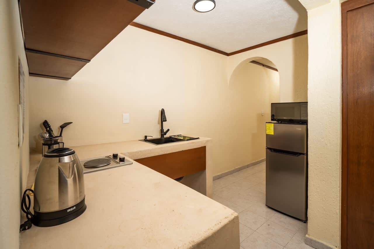 Fridge, microwave, stovetop, coffee/tea maker
