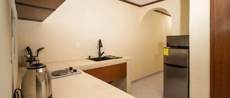 Fridge, microwave, stovetop, coffee/tea maker