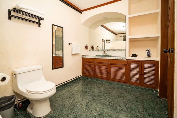 Shower, hair dryer, towels, shampoo