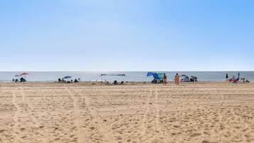 On the beach, sun loungers
