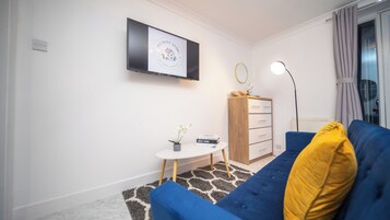 Apartment, Garden View | Living area | 40-inch Smart TV with digital channels, streaming services