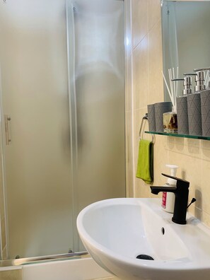 Hair dryer, towels, soap, shampoo