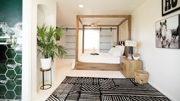A bedroom with a wooden bed, a ceiling fan, a bedside table with a lamp, and a wall-mounted picture of a horse. - Country Living on 1 acre in Paso Robles w/ AC, BBQ, starry nights, Dogs welcome (Paso Robles)