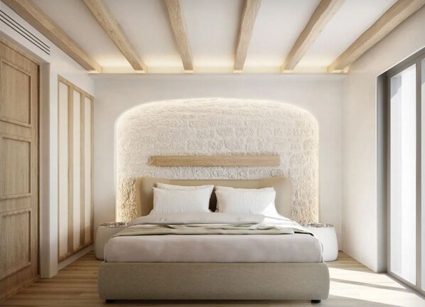 A modern bedroom with a large bed, a textured wall behind the bed, wooden beams on the ceiling, and a large window on the right. - Arocaria Hotel (Mykonos)