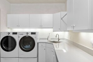 The spacious laundry room features a sink and plenty of counter space. We provide laundry supplies. - Vista Haus at Country Club - golf and ski retreat! (Mountain Village)