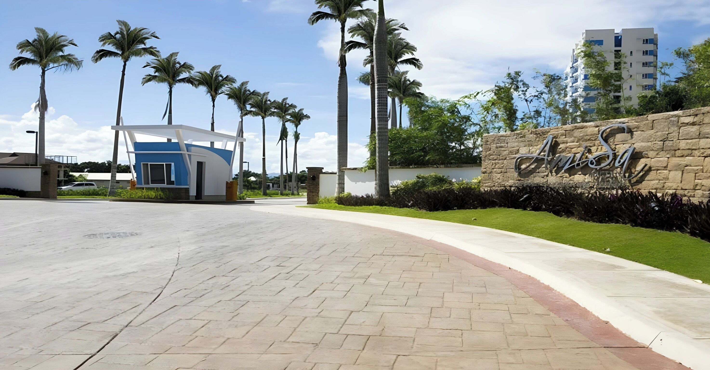 A paved pathway leading to a building with a sign that reads "Anisa."