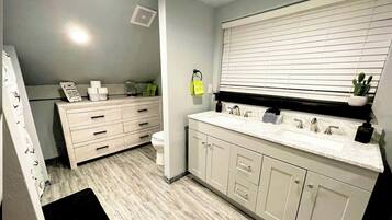 Shower, towels, soap, toilet paper