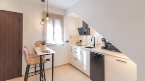 Fridge, microwave, stovetop, coffee/tea maker