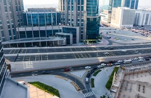 A multi-level parking structure with several lanes and a pedestrian crossing.