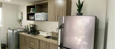 Fridge, microwave, stovetop, coffee/tea maker