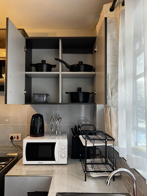 Fridge, microwave, coffee/tea maker, electric kettle