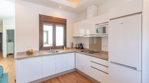 Fridge, microwave, stovetop, coffee/tea maker