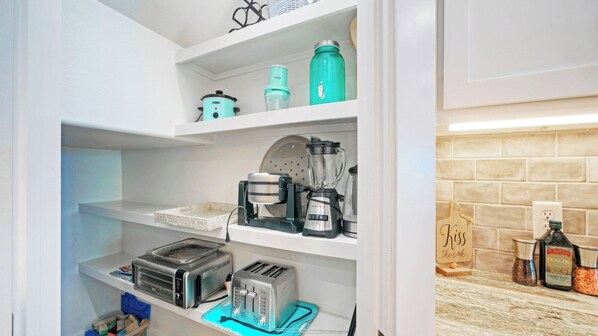 A kitchen with a toaster, blender, kettle, and a coffee maker on shelves. - Peaceful Paradise Private Pool, Balcony Views + 5 Mins to Whitecap Beach (Corpus Christi)