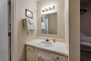 Shower, hair dryer, towels, shampoo