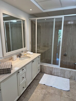 Shower, hair dryer, towels, soap