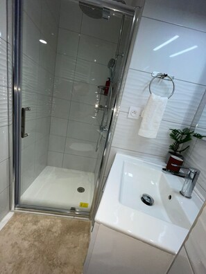 Shower, hair dryer, towels, soap