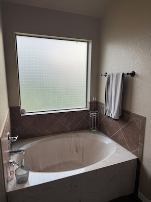 Jetted tub, towels, soap, toilet paper