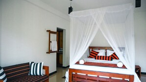 A bedroom with a wooden bed, white canopy, striped pillows, and a bench with striped cushions. - Duet hearts (Ella)