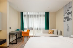 A hotel room with a bed, a desk, an orange chair, and a window with sheer curtains. - Madison Hotel Yangzhou East High-speed Railway Sta (Yangzhou)