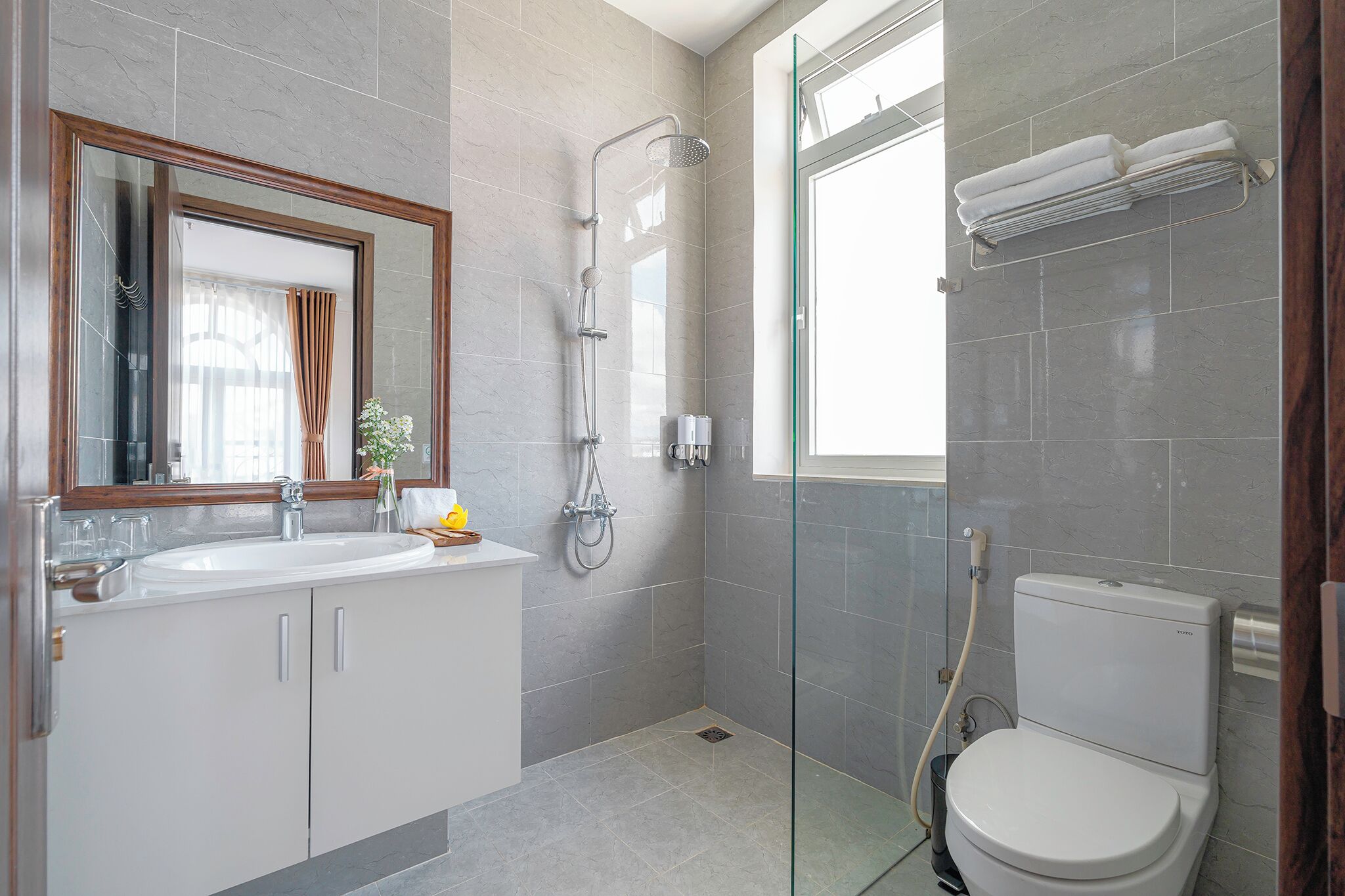 Shower, rainfall showerhead, designer toiletries, hair dryer