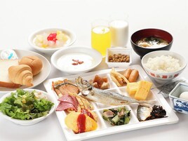 A variety of food items including fish, bread, and salad on a table.
