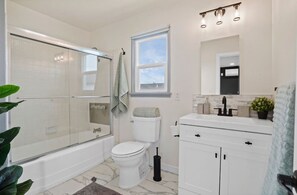 Shower, hair dryer, towels, soap