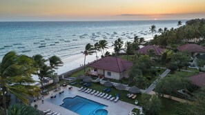 A resort with a swimming pool, beach view, and palm trees. - Mandarin Resort Zanzibar (Kizimkazi)