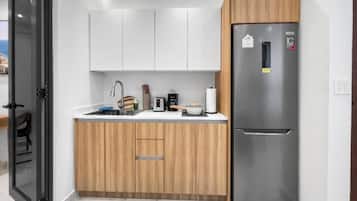 Fridge, microwave, stovetop, coffee/tea maker