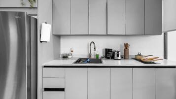 Fridge, microwave, stovetop, coffee/tea maker