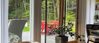 Peaceful riverfront house, dog-friendly, woodstove, decks, bbq, firepit, dock