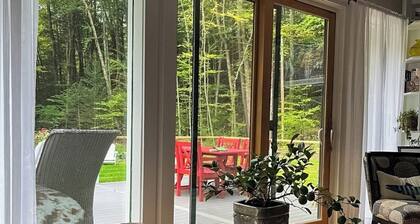 Peaceful riverfront house, dog-friendly, woodstove, decks, bbq, firepit, dock