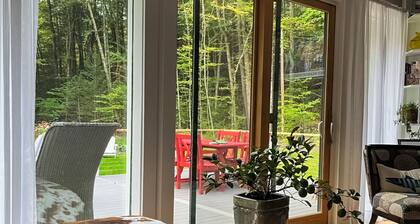 Peaceful riverfront house, dog-friendly, woodstove, decks, bbq, firepit, dock