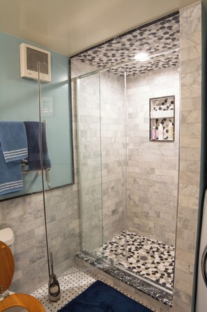 Shower, hair dryer, towels, soap