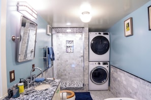 Shower, hair dryer, towels, soap