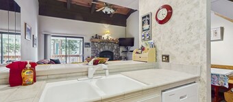Conveniently located condo with loft, fully stocked kitchen, balcony, wifi & TV