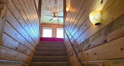 Conveniently located cabin with full kitchen, w/d, large deck & great views