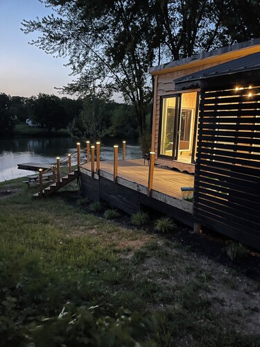 Unplug and unwind in this charming loft cabin nestled on the water’s edge.