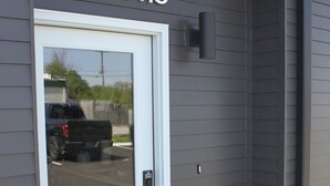 A residential entrance with a white door, a mailbox, and a welcome mat. - Live in Southside By Trails & Downtown + Parking (Chattanooga)