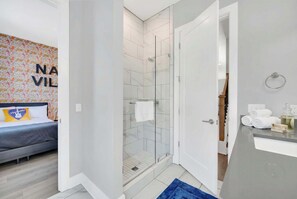 Shower, hair dryer, towels, shampoo