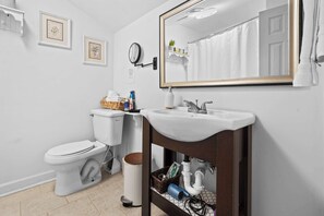 Shower, hair dryer, towels, shampoo