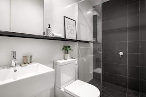 Shower, hair dryer, towels, shampoo
