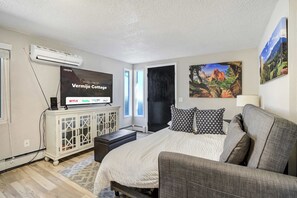 1 bedroom, desk, iron/ironing board, travel crib