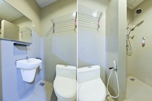 A bathroom with a sink, toilet, and shower. - Hotel O Rayyan Soffea Managed by Oravel (Kota Bharu)