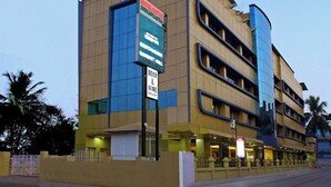 A multi-story hotel with a prominent sign for 'Hotel & Restaurant'. - Hotel Indraprastha Kayamkulam (Kayamkulam)